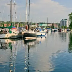 A group of boats docked in a marina. A group of boats docked in a marina.