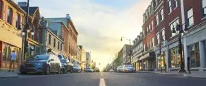 A city street with cars parked on it. A city street with cars parked on it.